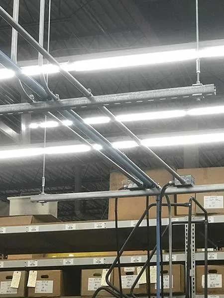 Conduit runs suspended from high ceilings by Elite Electric